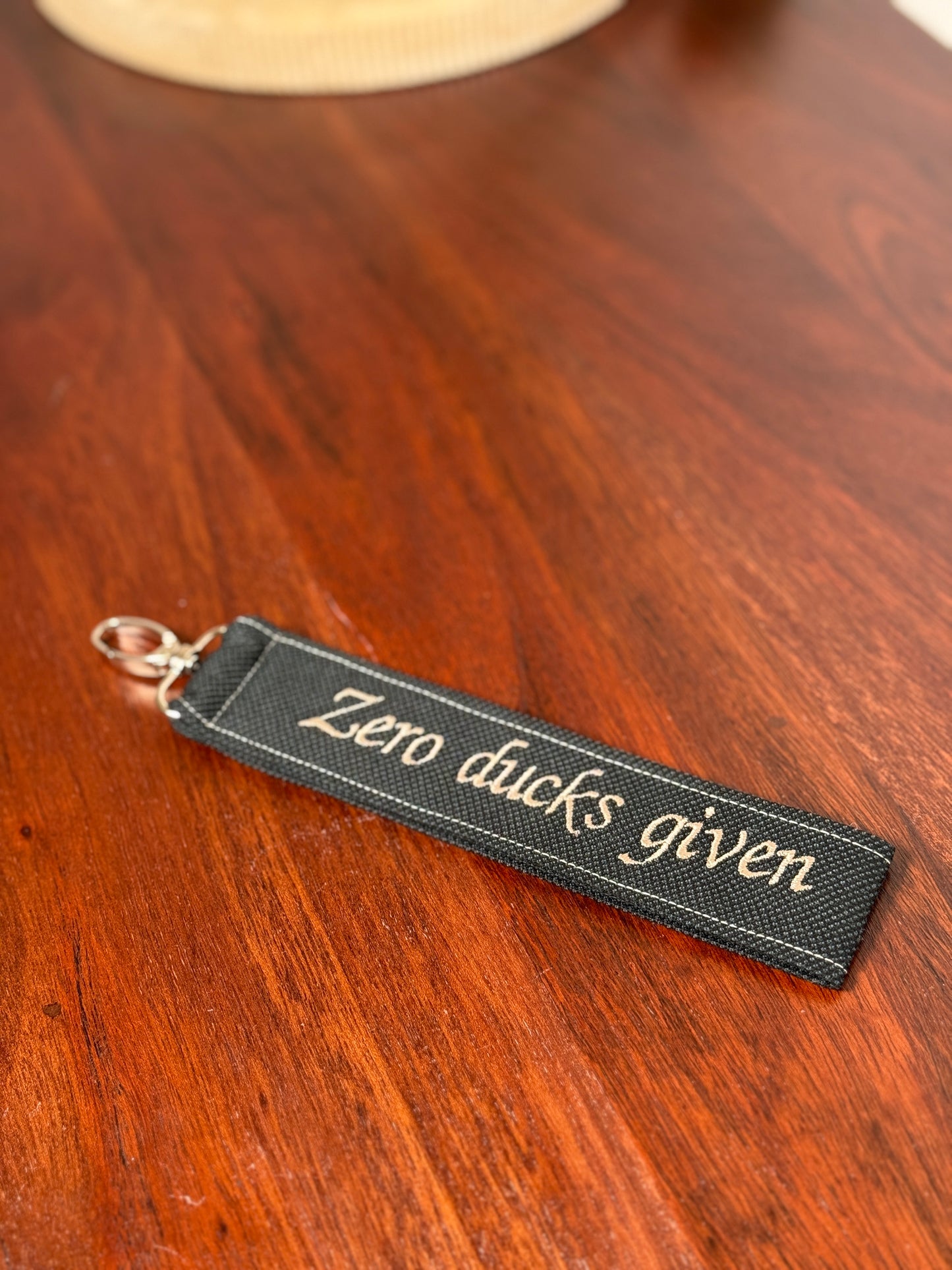 Handy-/Schlüsselhandschlaufe inkl. Handyhalterung - "Zero ducks given"