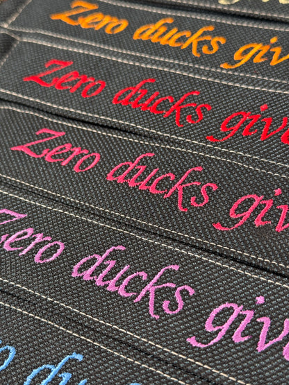 Handy-/Schlüsselhandschlaufe inkl. Handyhalterung - "Zero ducks given"