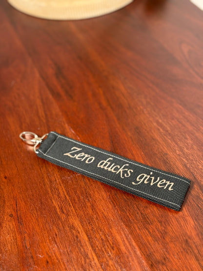 Handy-/Schlüsselhandschlaufe inkl. Handyhalterung - "Zero ducks given"