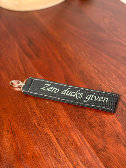 Handy-/Schlüsselhandschlaufe inkl. Handyhalterung - "Zero ducks given"