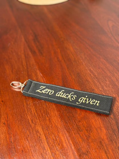 Handy-/Schlüsselhandschlaufe inkl. Handyhalterung - "Zero ducks given"
