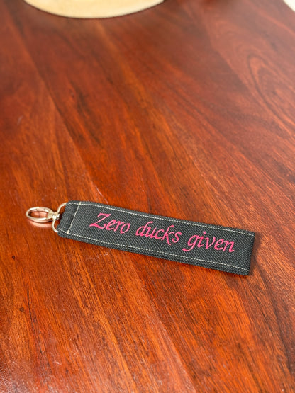 Handy-/Schlüsselhandschlaufe inkl. Handyhalterung - "Zero ducks given"