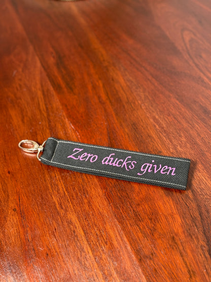 Handy-/Schlüsselhandschlaufe inkl. Handyhalterung - "Zero ducks given"