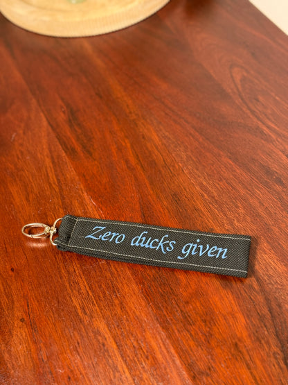 Handy-/Schlüsselhandschlaufe inkl. Handyhalterung - "Zero ducks given"