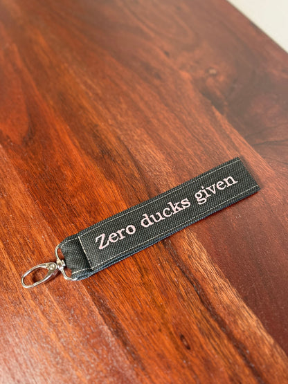 Handy-/Schlüsselhandschlaufe inkl. Handyhalterung - "Zero ducks given"